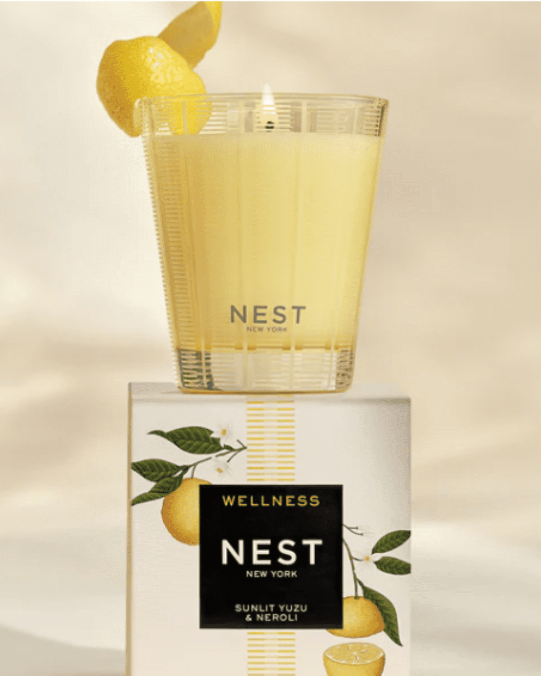 Nest Sunlit Yuzu & Neroli Candle part of a beauty routine.