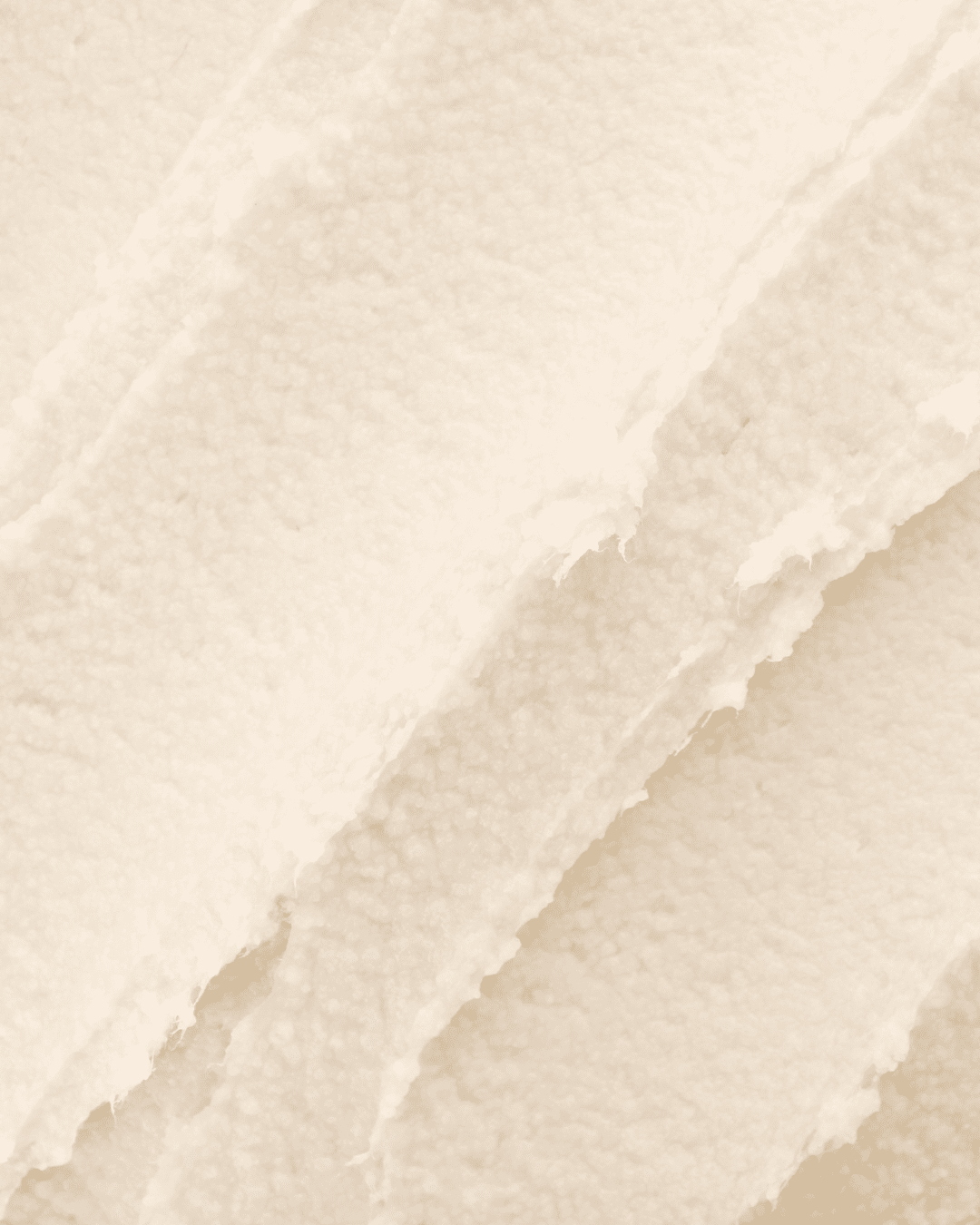 Close-up texture of shea butter, a key ingredient in the PRAI Beauty Necks-Generation Future Proof Night Cream, showing its creamy and rich consistency. Part of the fall self-care & beauty guide.