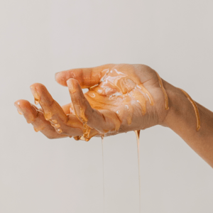 A hand with honey on it