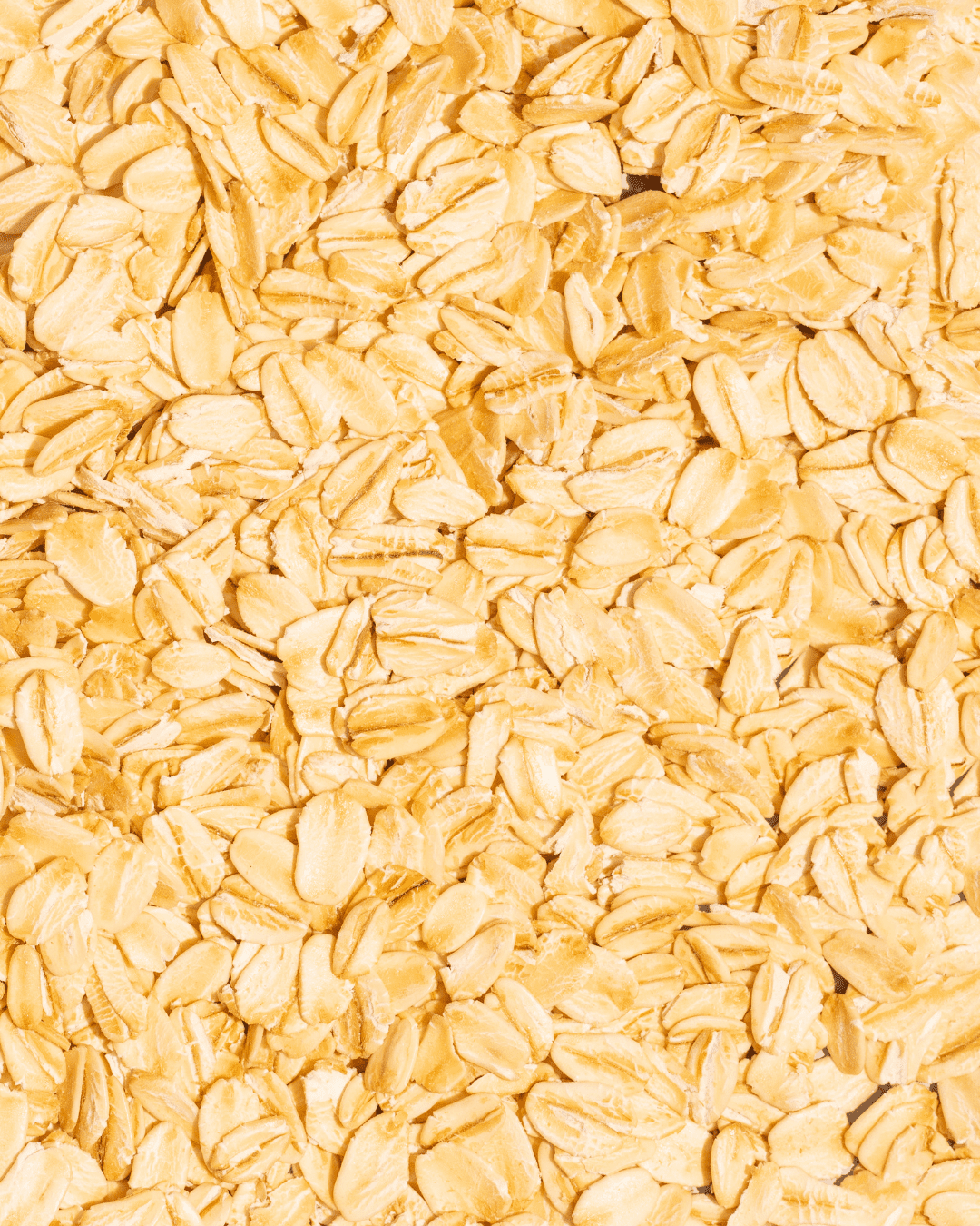 Oat Kernel Extract, a key ingredient in the PRAI Beauty Necks-Generation Future Proof Night Cream, displayed as whole oat grains.