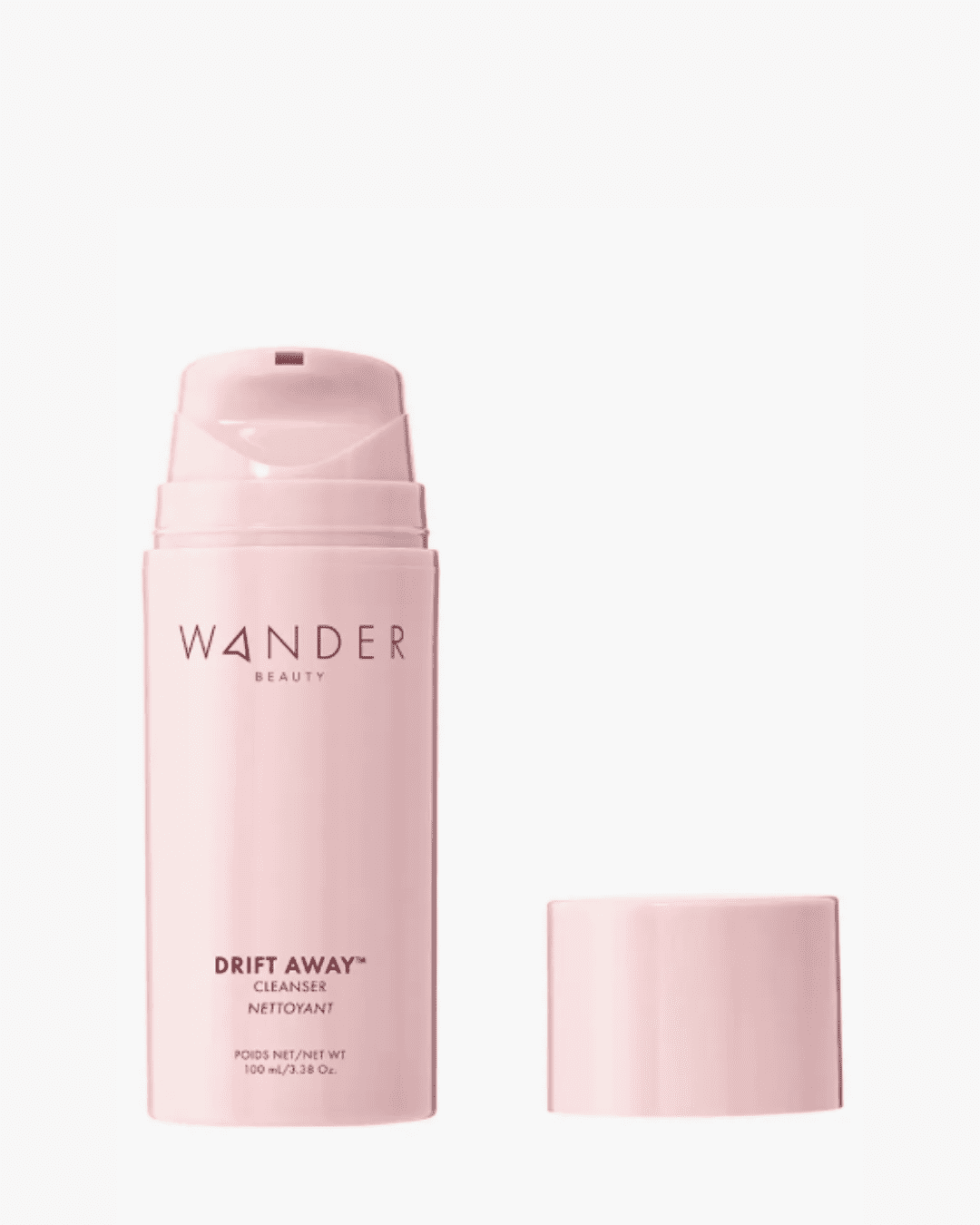 Updated Wander Beauty Drift Away™ Cleanser with all-pink bottle and shorter pump next to cap on white surface; a gentle cleanser as a safe alternative to raw egg face masks.