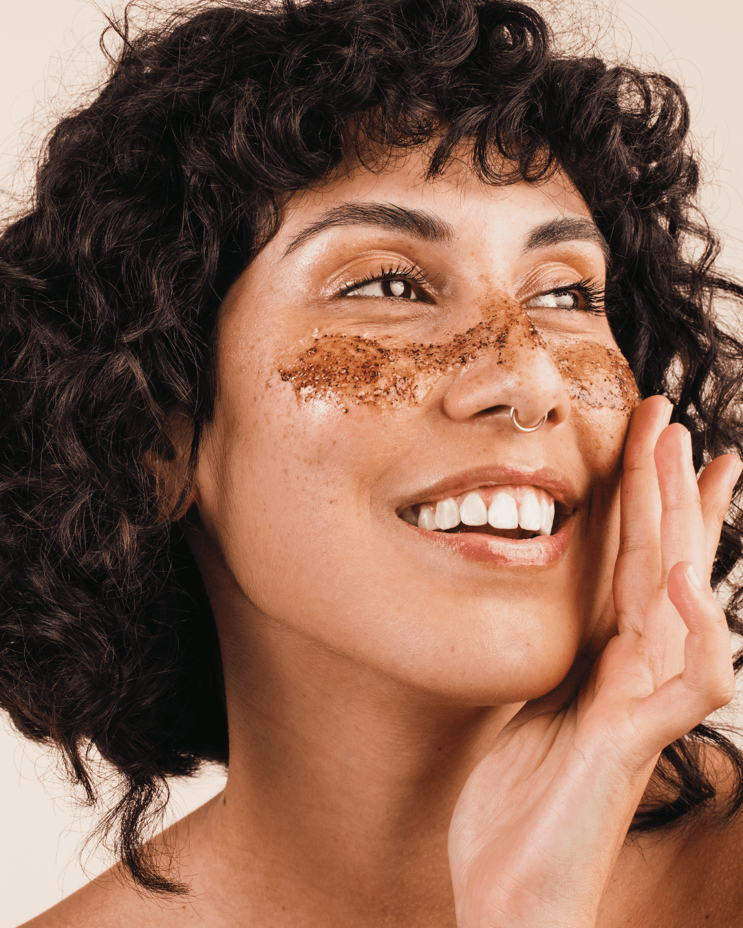 Coffee grounds on a woman's face