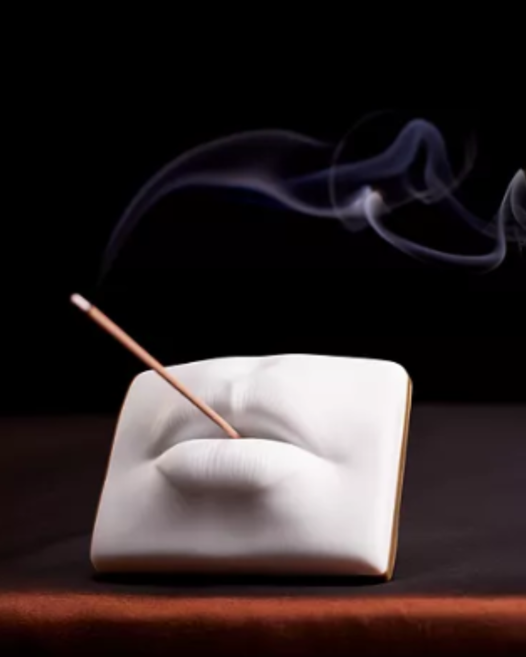 L’Objet Smoking Lips incense holder in white porcelain with gold-toned brass, styled to invite positivity into your home