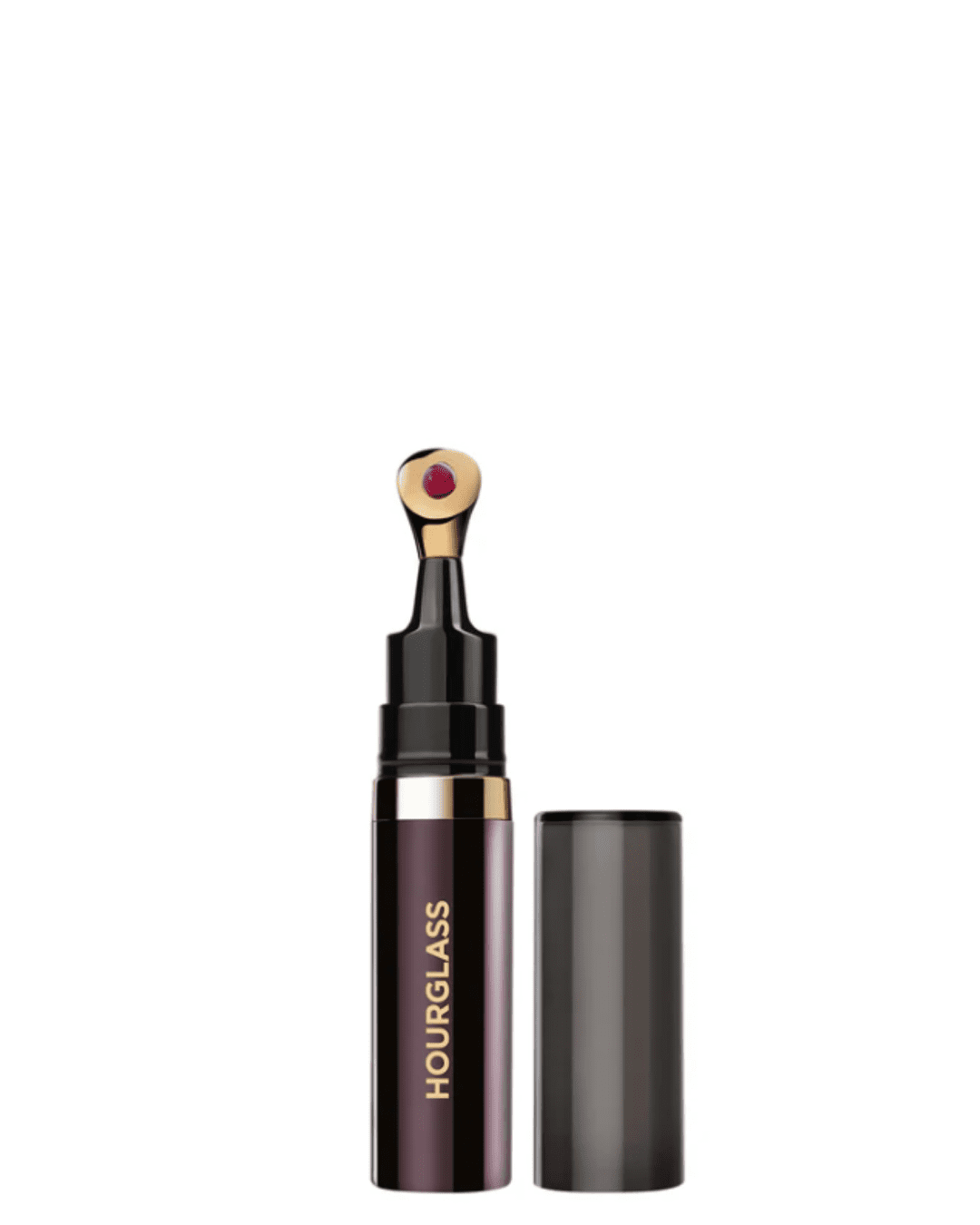 Hourglass No. 28 Lip Treatment Oil on a white surface and white background in this fall self-care guide.