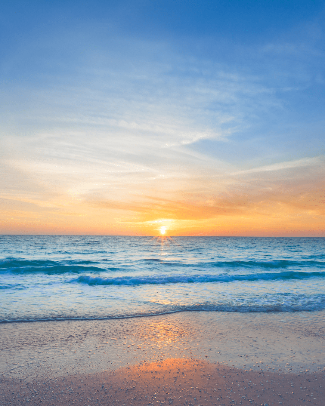 Calm ocean waves at sunset, representing the sea-inspired mindfulness ritual paired with Algenist's Liquid Skin Resurfacing 2% BHA Toner.