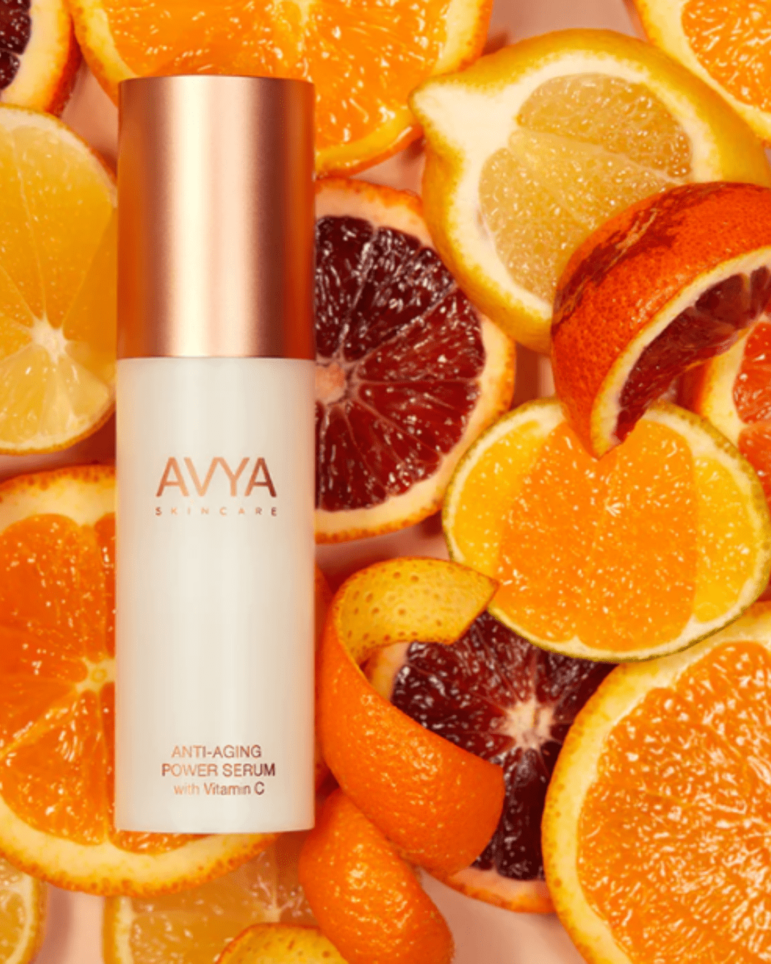 AVYA Advanced Ayurvedic Skincare Anti-Aging Power Serum – The Energy Boost on a bunch of slices of oranges and blood oranges. A product that is Ayurvedic skincare.