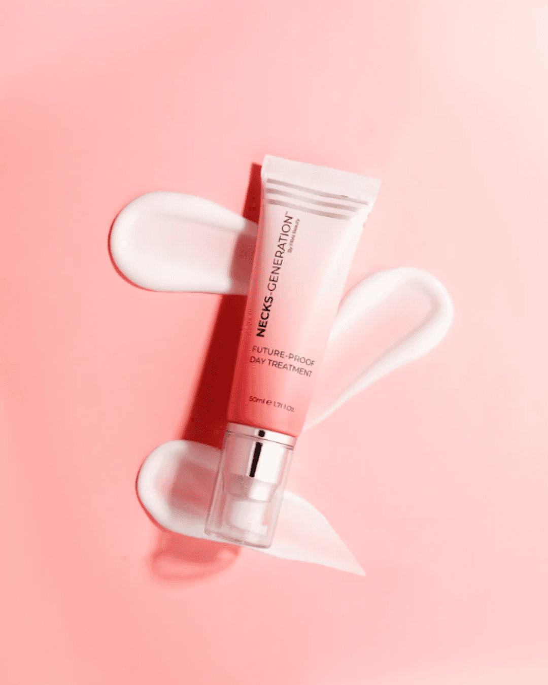 PRAI Beauty Necks-Generation Future-Proof Day Treatment on a light pink background with three swatches of the cream behind the product.