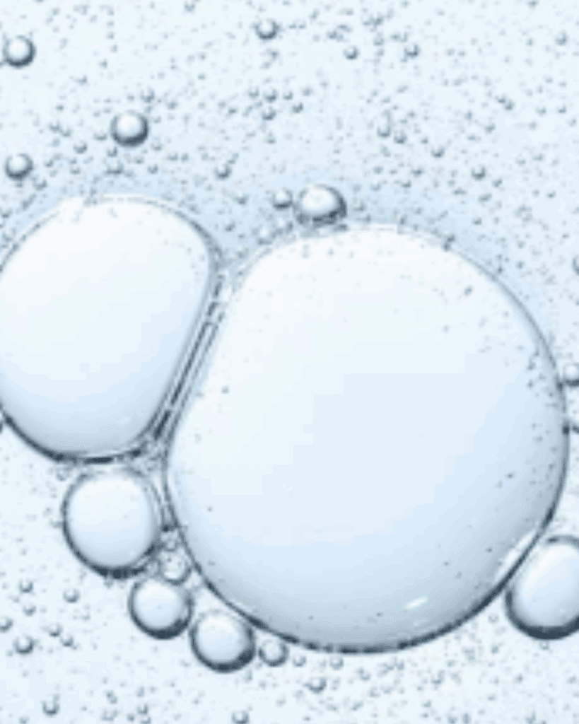 Blue liquid with large suspended bubbles representing the BHA salicylic acid in the Algenist Liquid Skin Resurfacing 2% BHA Toner.