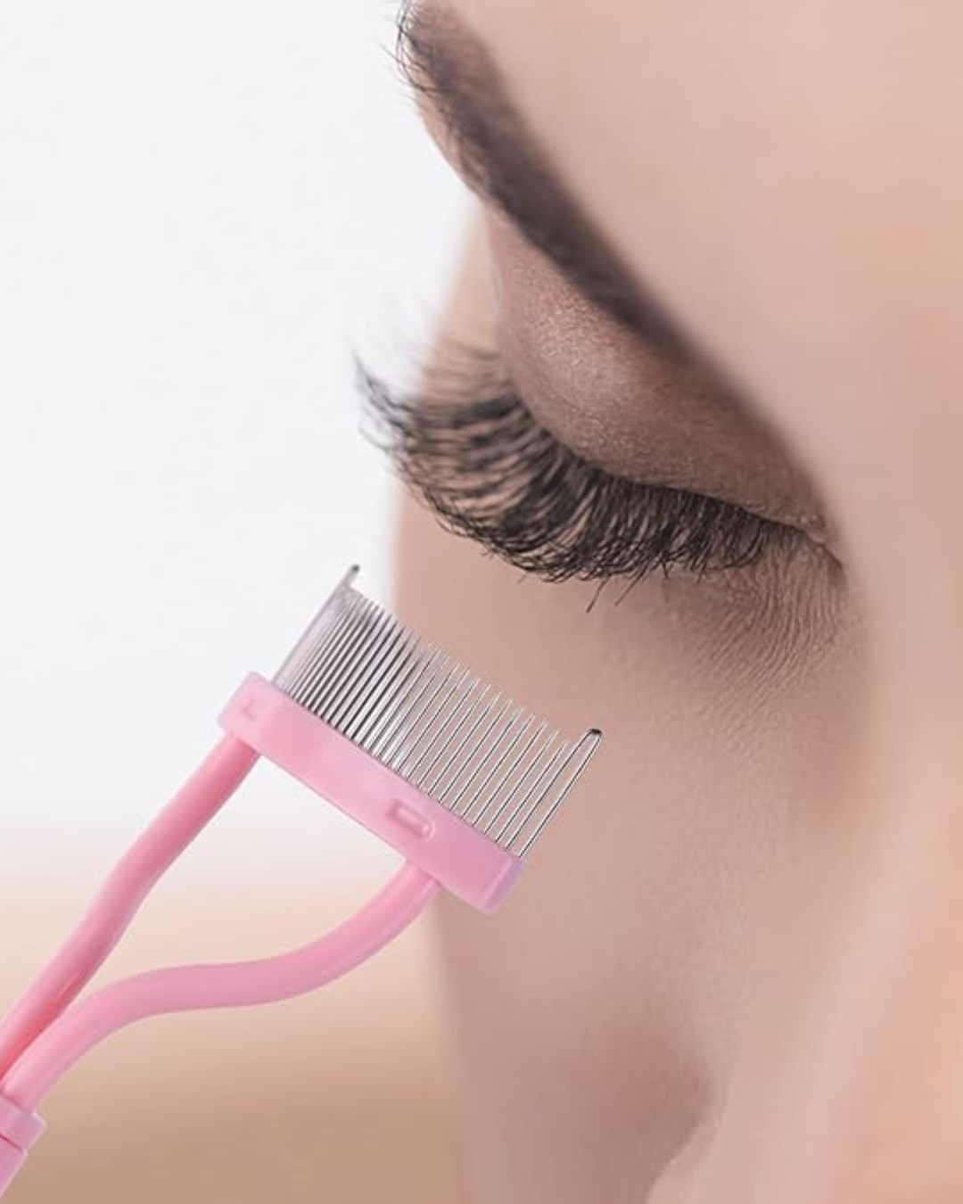 Pink mascara lash comb