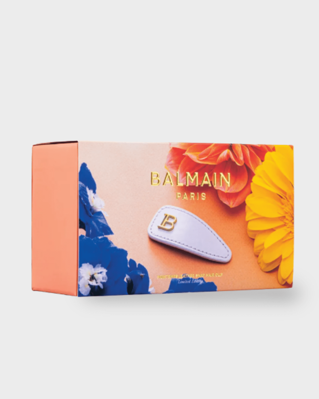 Balmain Hair Limited Edition Printemps Leather Snap Hair Clip packaging, tan box with gold branding, unboxing view.