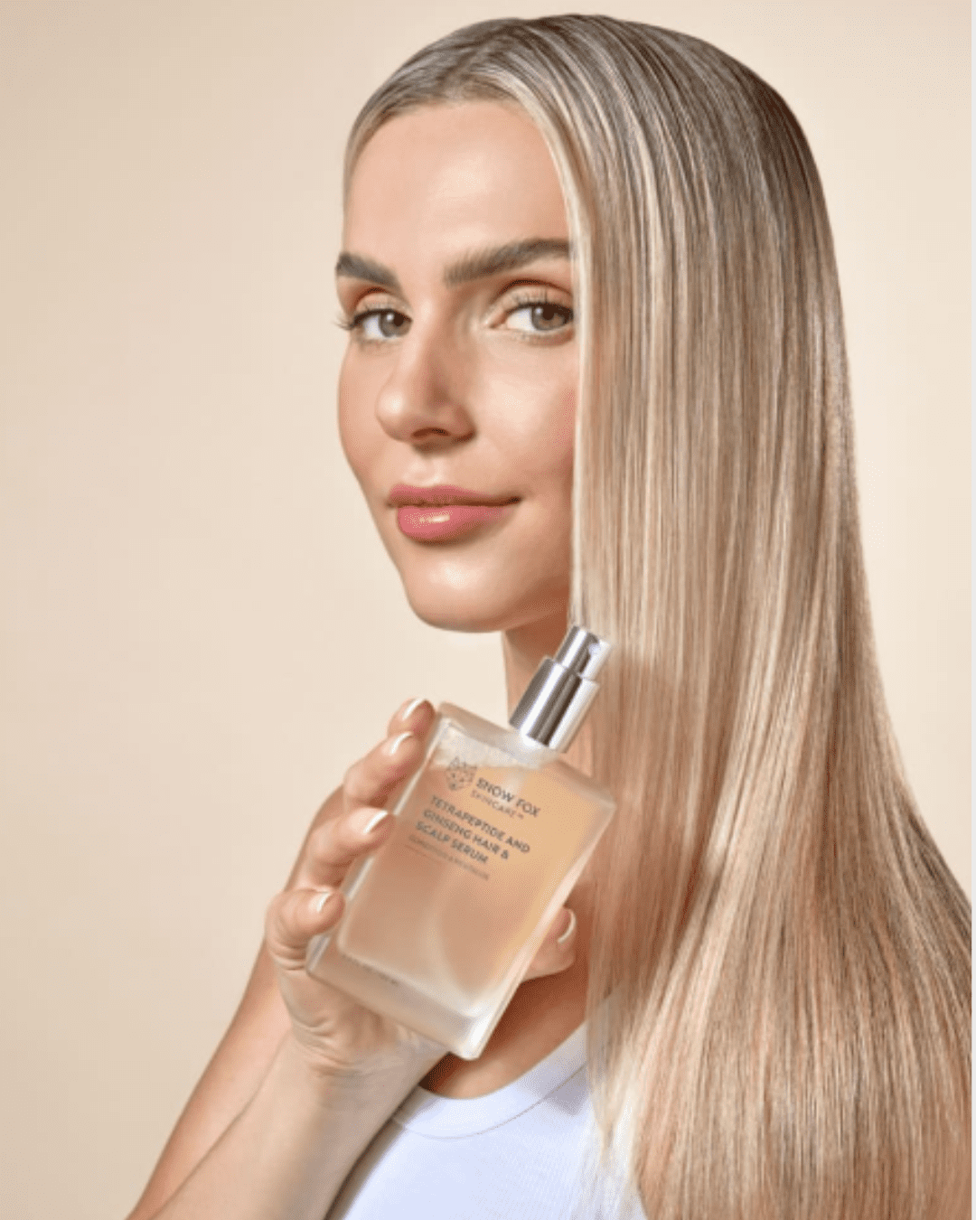 Blonde woman with hair fully treated using SNOW FOX Tetrapeptide and Ginseng Hair and Scalp Serum, show casing smooth, nourished results on both sides.