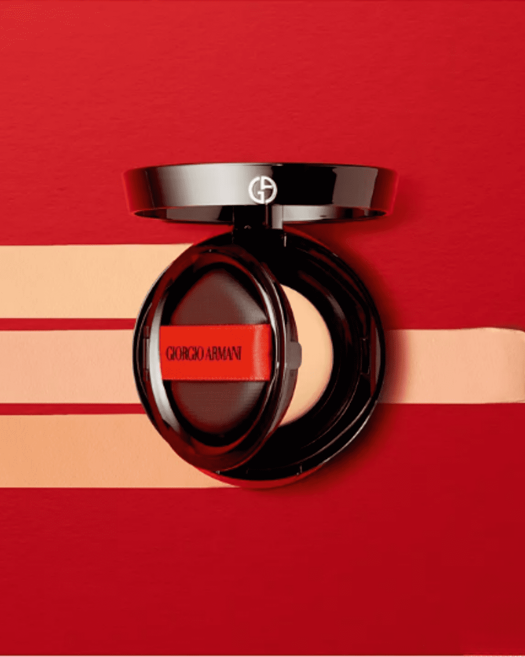 Giorgio Armani Power Fabric Foundation Compact with three shade swatches displayed on red background.