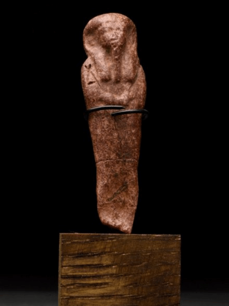 Ancient Egyptian Bee Wax Ushabti on Stand sold at auction for $127.83. Used as a candle mold.