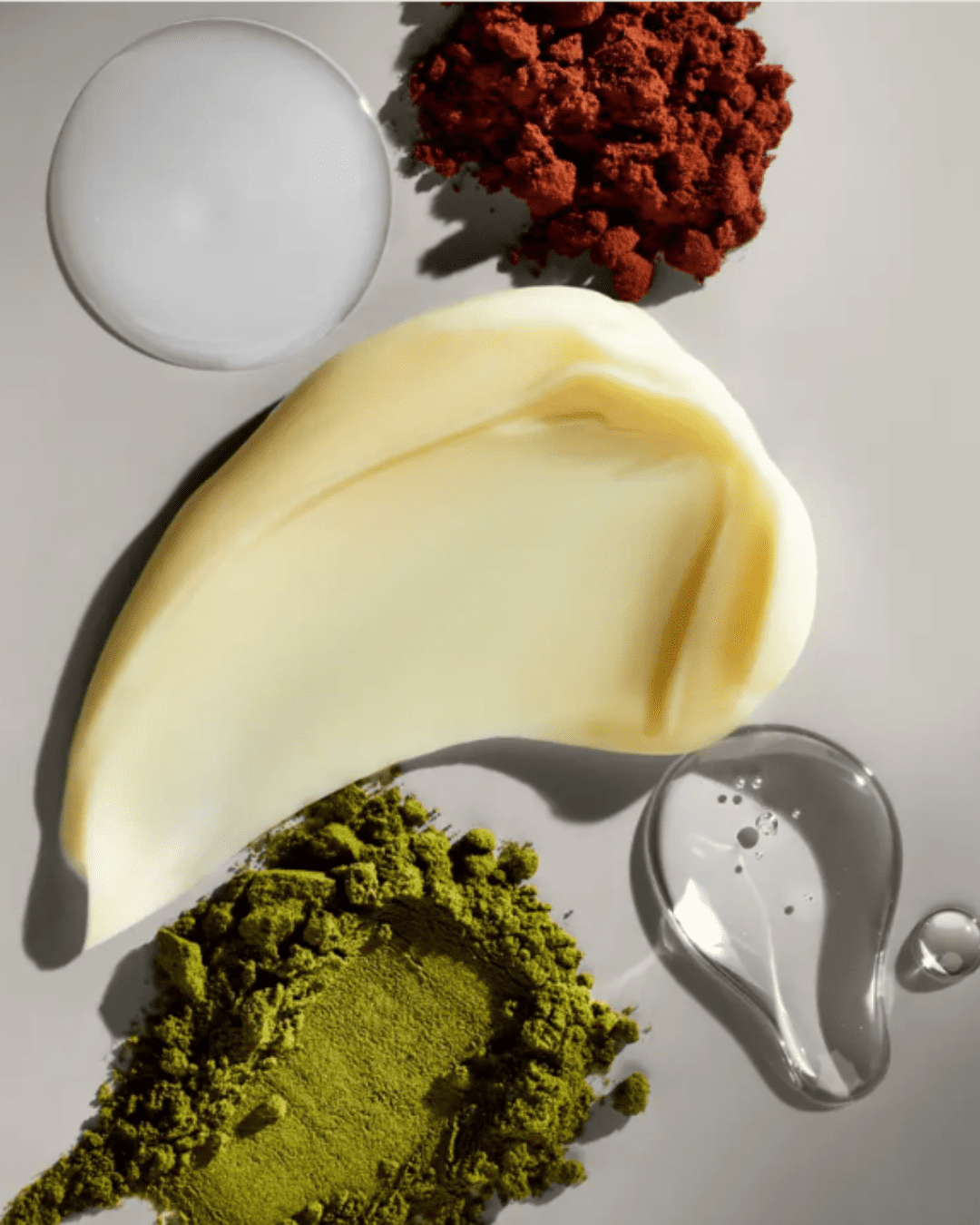 Swatches showing the variety of textures in the Agency Skincare Eye Formula anti-aging moisturizer, including creamy, dry, and gel-like formulations, representing the ingredients used in the personalized formula.