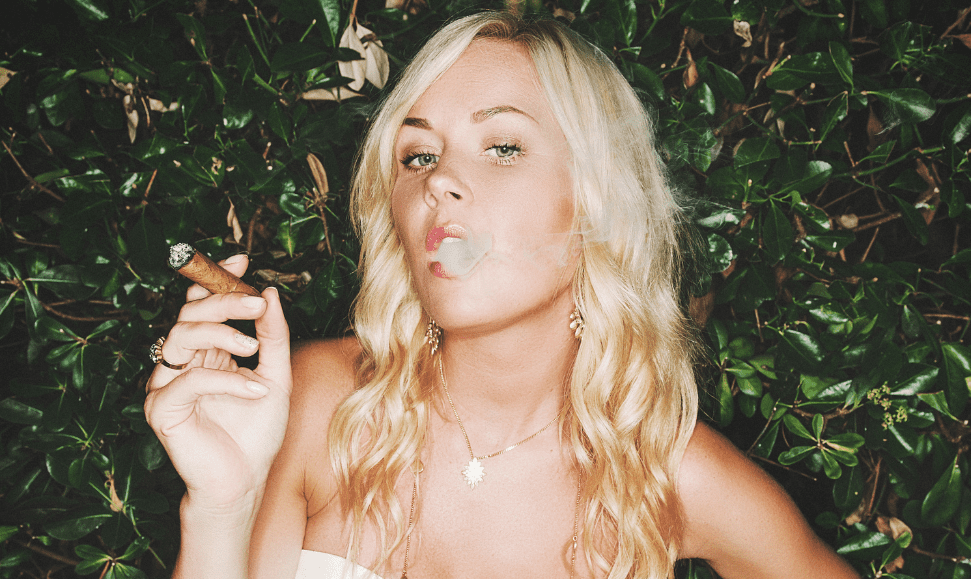 Young blonde smoking a cigarette