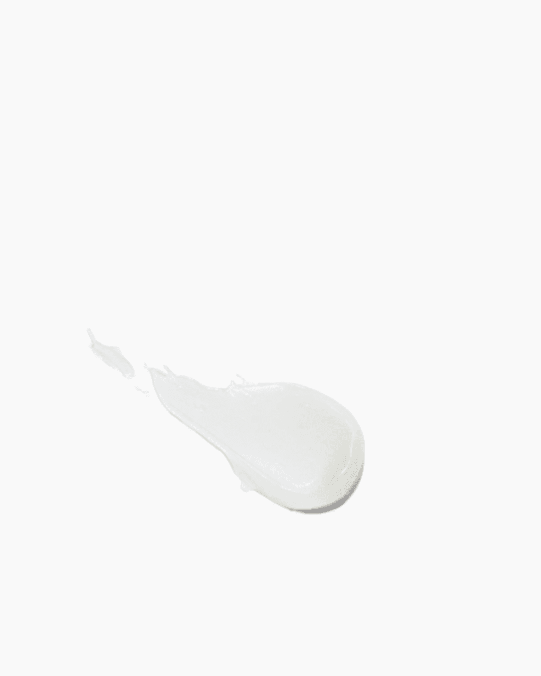 Swatch of DRMTLGY SPF 25 Lip Balm on a white background, showing the creamy texture and moisturizing coverage of the product.
