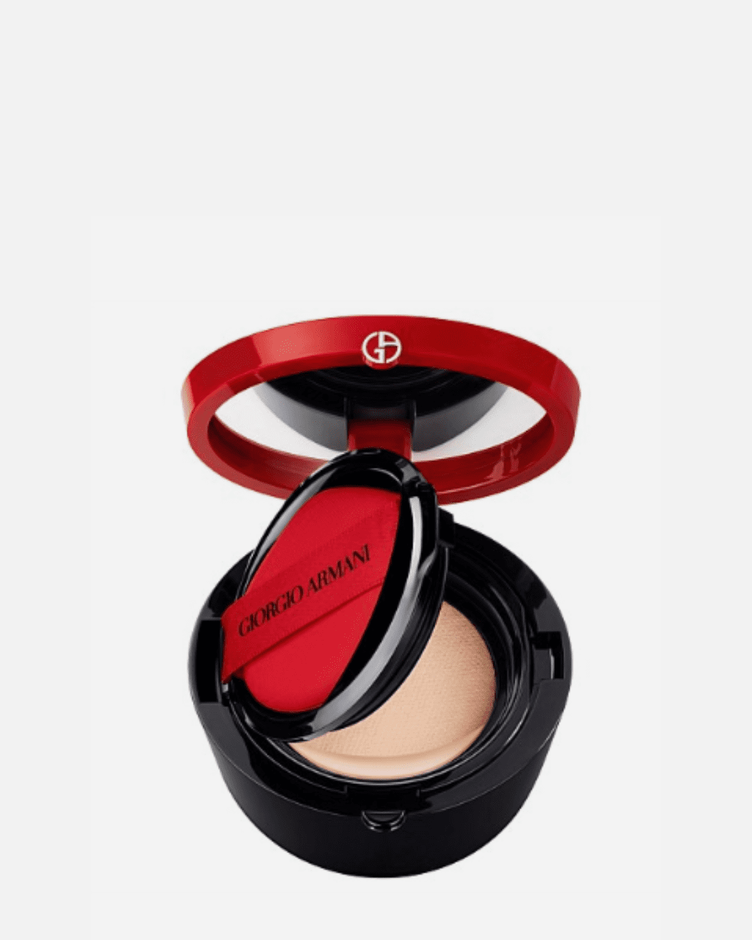 Giogio Armani To Go Cushion Refill open on light gray surface with powder puff and foundation visible inside.