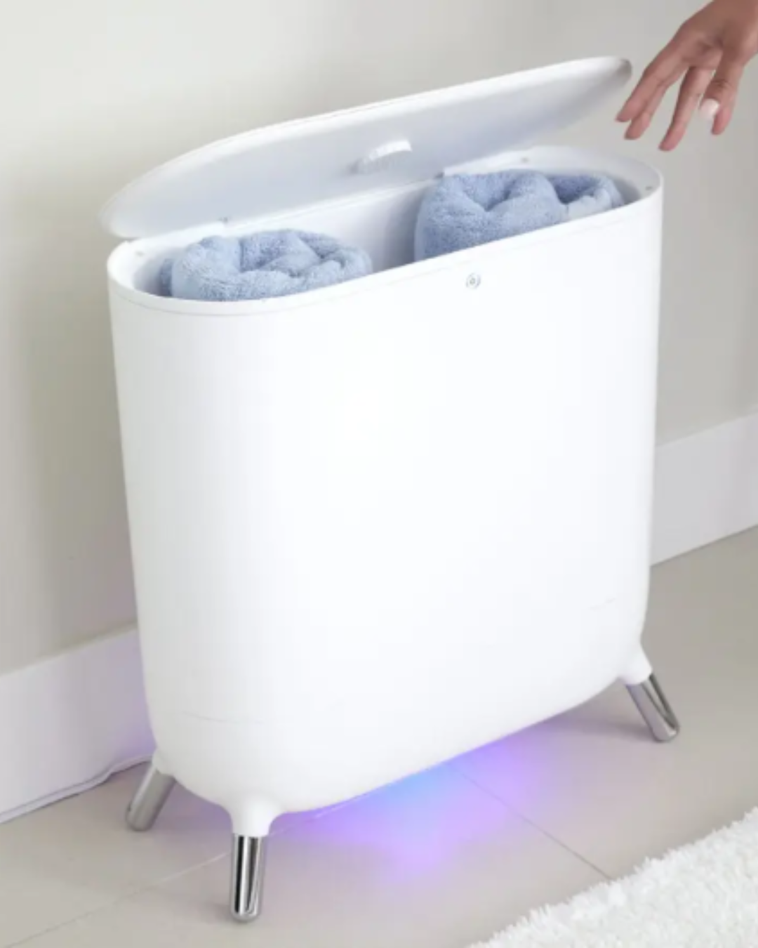 Sharper Image Spa Studio Towel Warmer showing two blue towels inside, offering spa-like comfort for a mindful self-love practice at home.