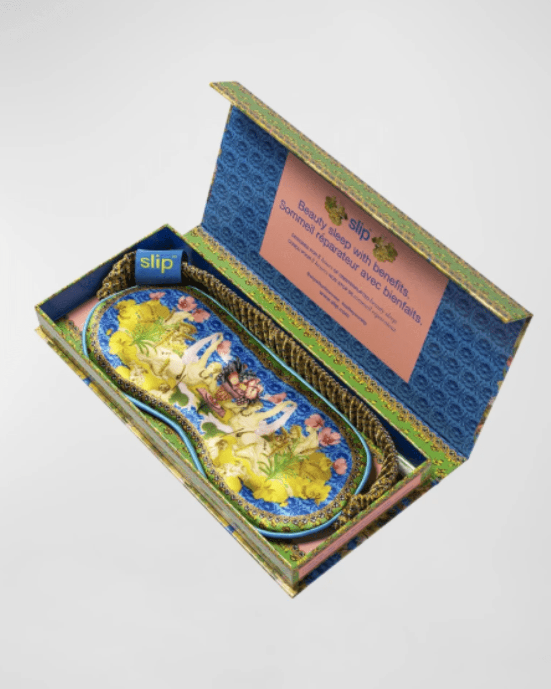 Slip Pure Silk Zodiac Sleep Mask displayed inside its packaging on a light gray surface, showing the product presentation and luxury gift-ready design.