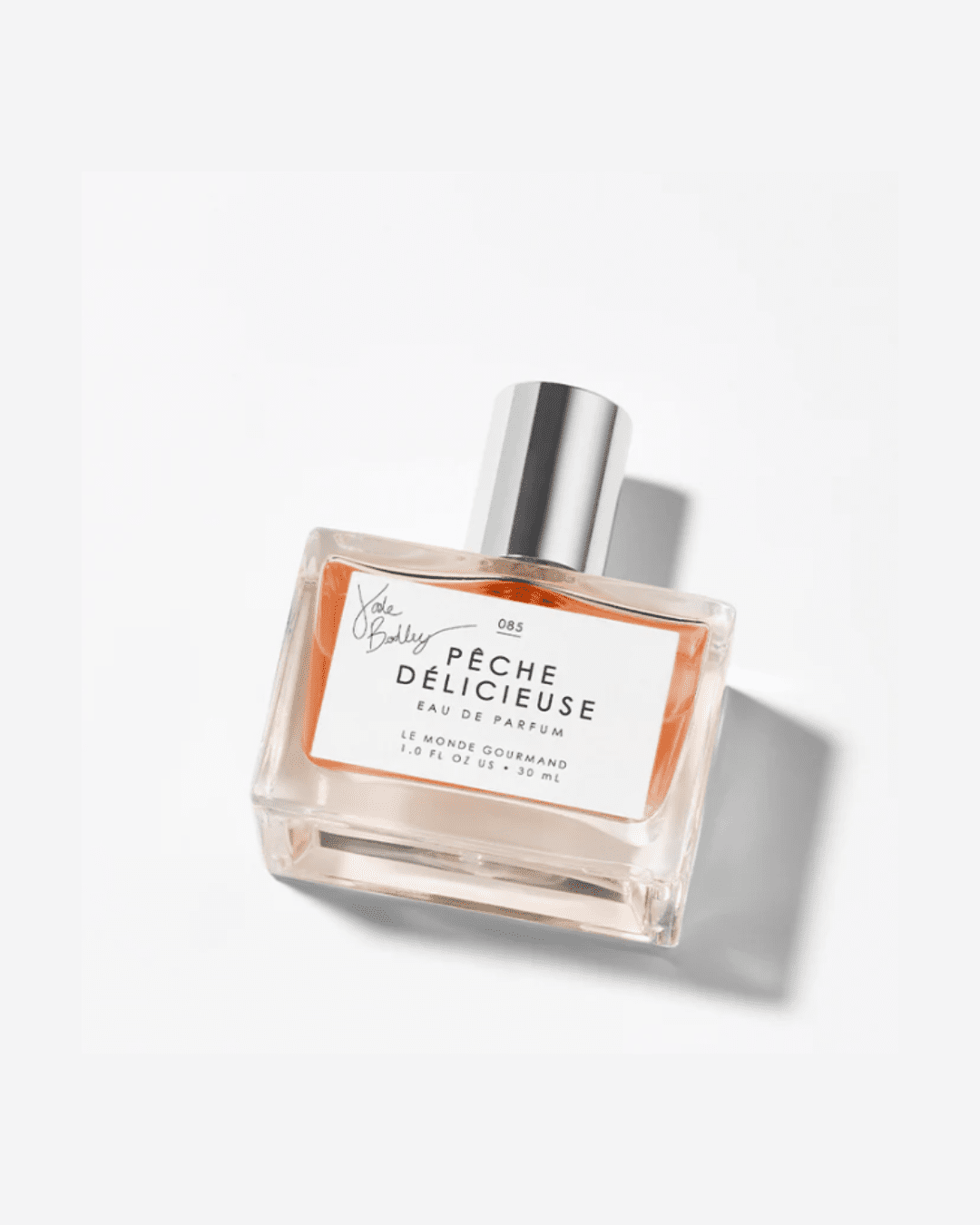 Le Monde Gourmand Pêche Délicieuse Eau de Parfum bottle displayed on a clean white background.