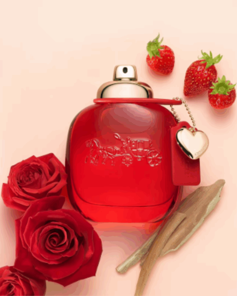 Coach Love Eau de Parfum bottle displayed on a peach backdrop, highlighting strawberry perfumes.