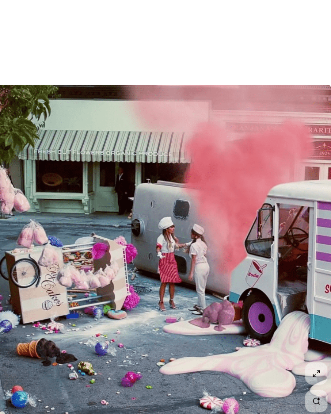 Ariana Grande in two outfits at a cotton candy and bread truck accident scene. Sweet Like Candy Eau de Parfum inspired this imaginative candy perfume moment.