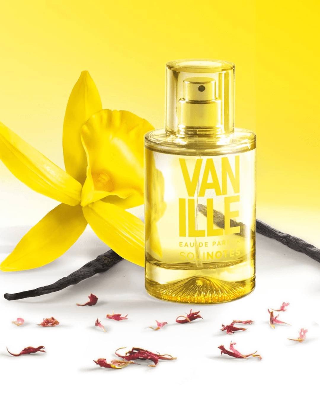 Vanilla Eau de Parfum by SOLINOTES perfume bottle with a yellow flower, vanilla beans, and red petals, a sweet addition to cupcake-inspired perfumes.