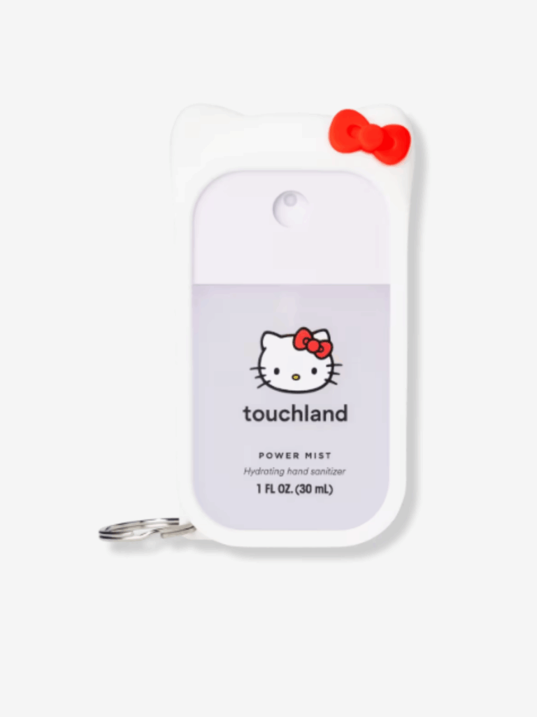 Touchland x Hello Kitty Power Mist Hand Sanitizer displayed on a clean white background. The white case features Hello Kitty's cat ears, red bow and white color. Hello Kitty's face is above the Touchland logo on the front of the sanitizer product.