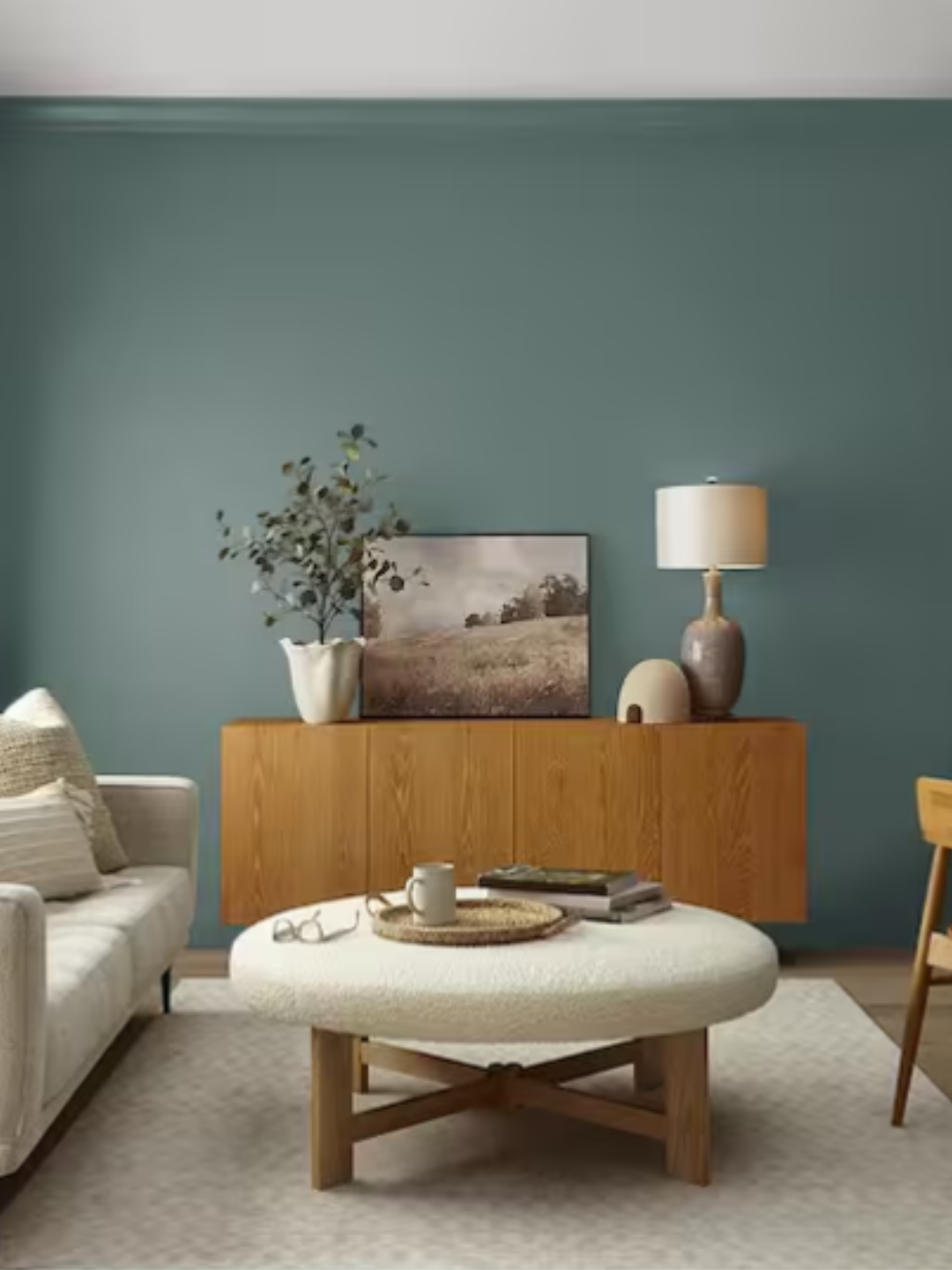 Hidden Gem is painted on a living room wall with living room furniture in the room.