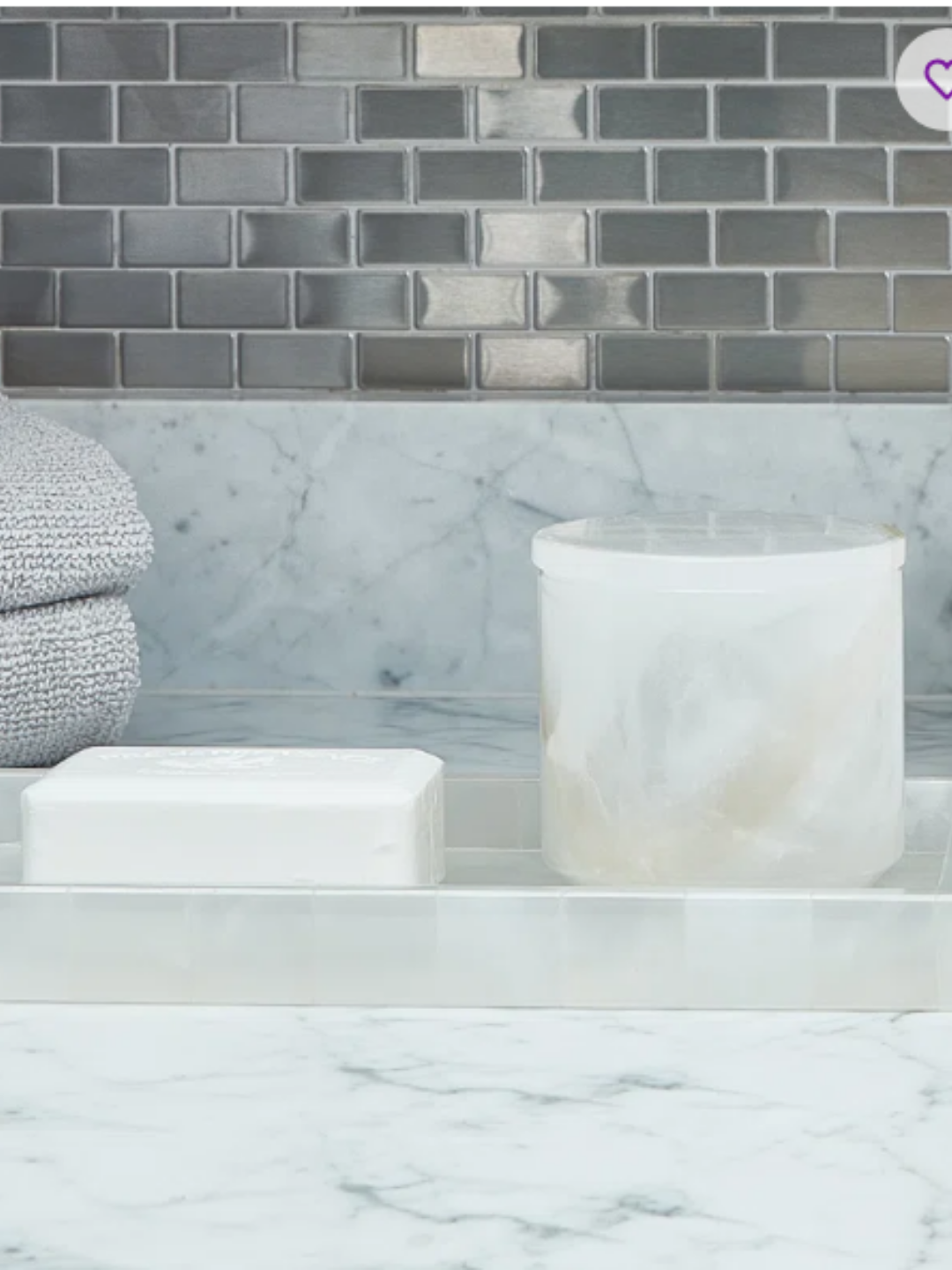 A natural stone toothbrush and soap holder.