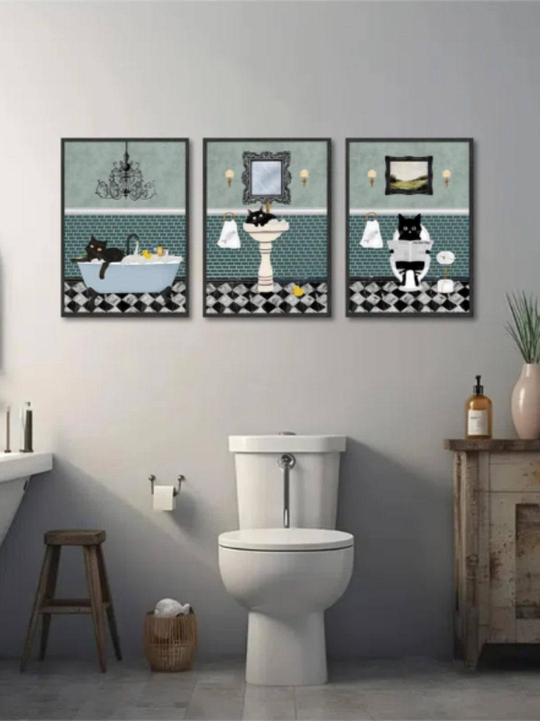 Three pictures of cats in a bathroom placed on the wall of a bathroom.