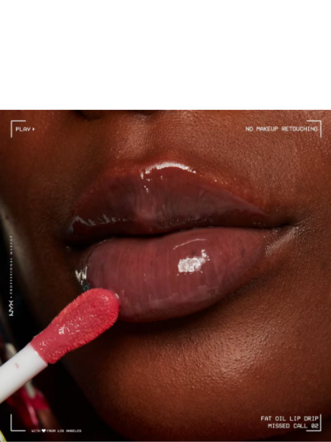 Black woman applying NYX Fat Oil Lip Drip in the shade "Living the Cream" to her lips, showing the glossy nude shade and hydrating finish on her lips; beauty application photo.