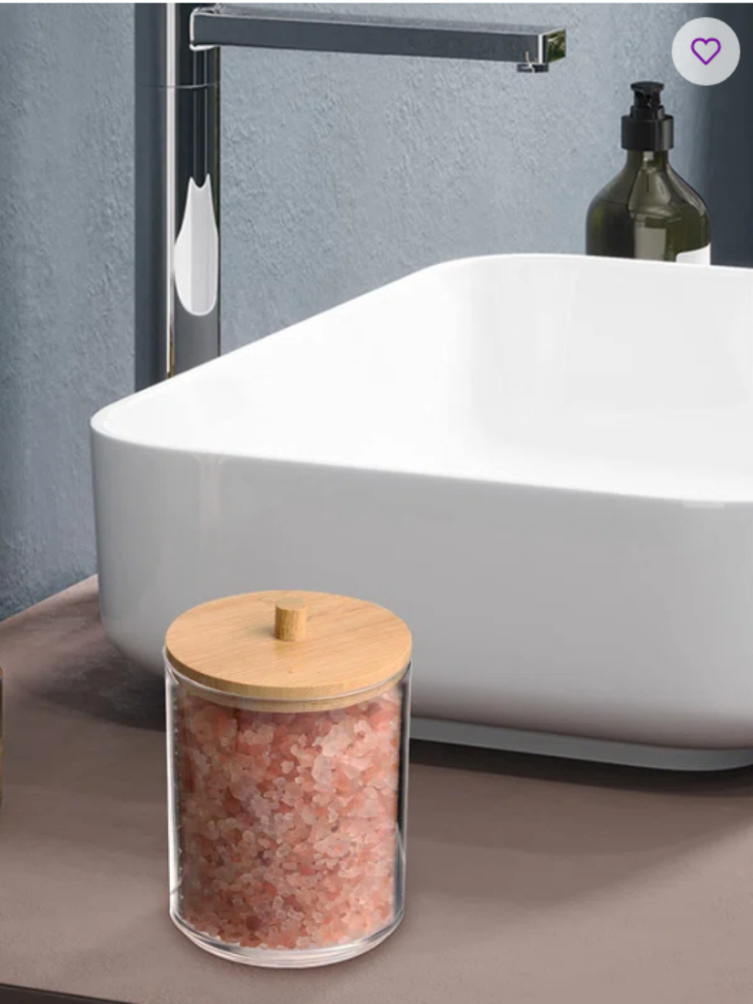 A natural wood and glass bathroom item container on a bathroom counter with a white modern sink in the background.