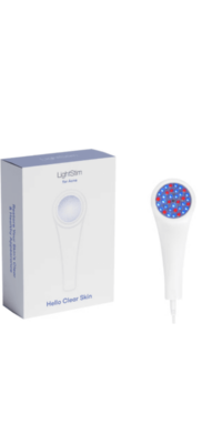 LightStim for Acne product display on a white background. The image shows the white box with a gray blue lid, text on the front reading "Hello Clear Skin', and a partial side view with the text "Restore Your Skin's Clear and Healthy Appearance". Next to the box is the white LightStim for Acne device, with the circular light area showing mostly blue light with some red dots.