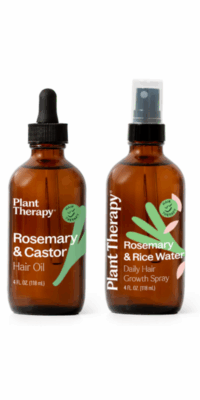 Plant Therapy Ultimate Hair Growth Bundles- Rosemary fand Castor Hair Oil on the left and Rosemary and Rice Water Daily Hair Growth Spray on the right, both brown bottles with green and pink designs, photographed on a white surface with soft shadows and clean white background.